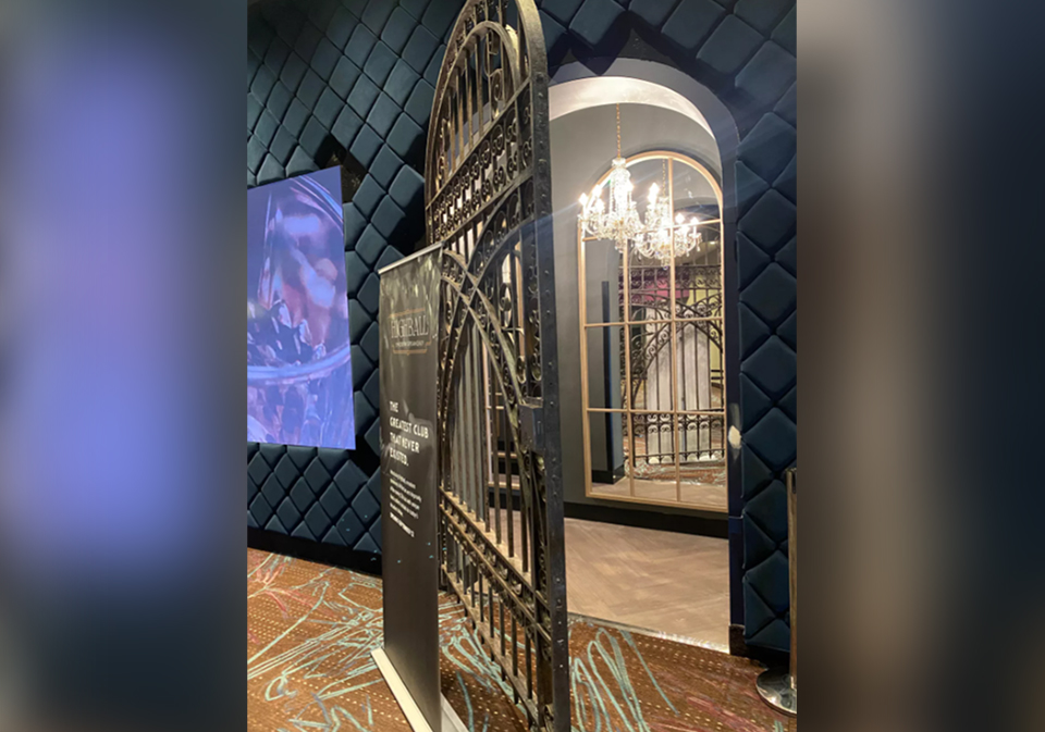 Restored, arched gate partially open and reflected in hallway mirror. Restoration by David Kailey.